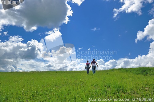 Image of Portrait of romantic young couple smiling together outdoor