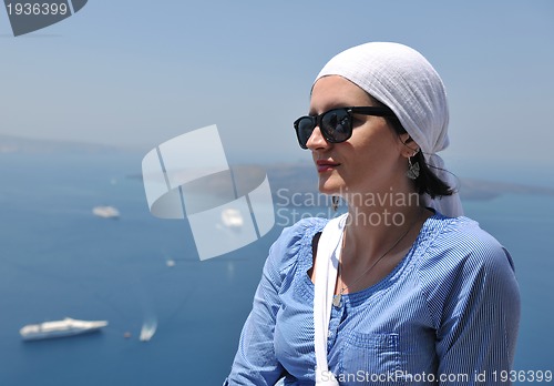 Image of Greek woman on the streets of Oia, Santorini, Greece