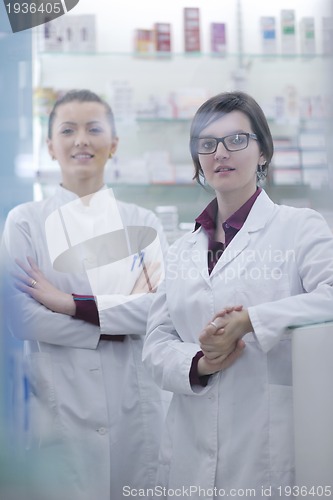 Image of team of pharmacist chemist woman  in pharmacy drugstore