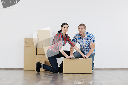 Image of Young couple moving in new house