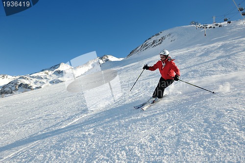 Image of skiing on fresh snow at winter season at beautiful sunny day