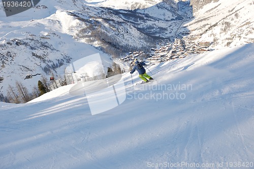 Image of skiing on fresh snow at winter season at beautiful sunny day