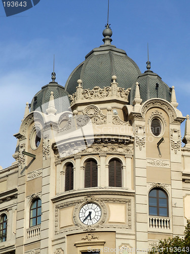 Image of Building with clock and domes