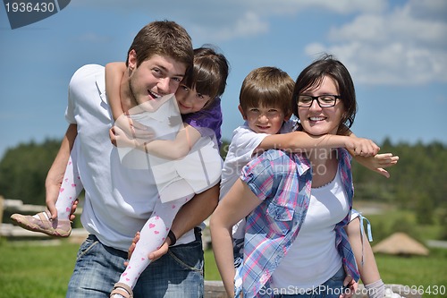Image of happy young family have fun outdoors
