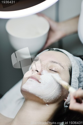 Image of woman with facial mask in cosmetic studio