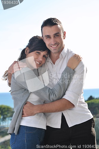 Image of couple relaxing on balcony