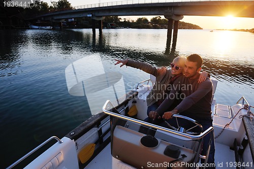 Image of couple in love  have romantic time on boat