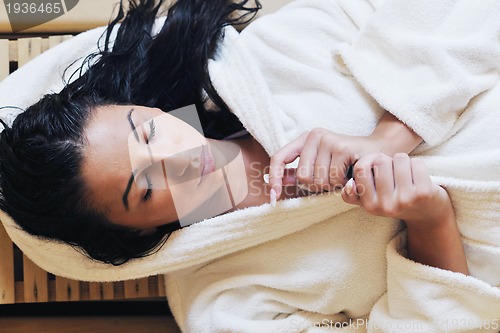 Image of Young woman take a steam bath