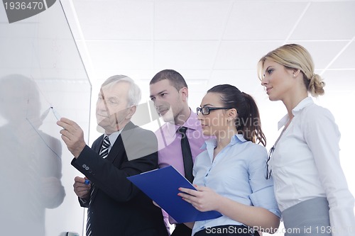 Image of Senior business man giving a presentation