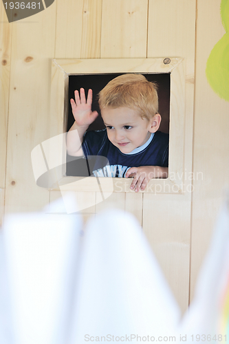 Image of happy child in a window