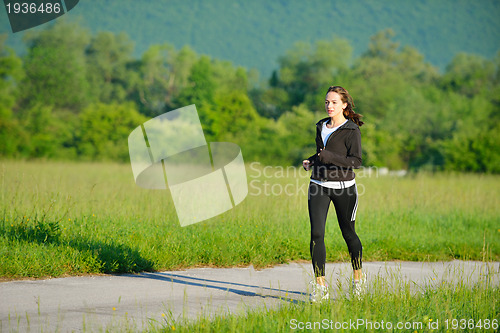 Image of Young couple jogging