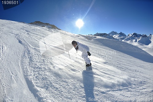 Image of skiing on fresh snow at winter season at beautiful sunny day