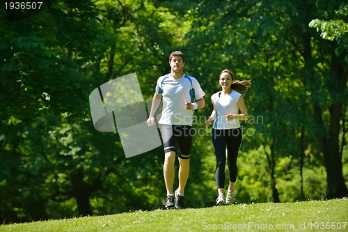 Image of Young couple jogging