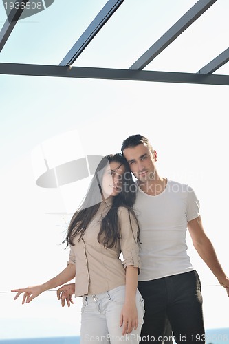 Image of couple relaxing on balcony