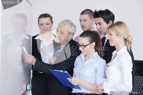 Image of Senior business man giving a presentation