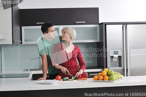 Image of young couple have fun in modern kitchen