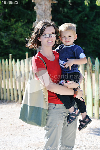 Image of woman and child have fun outdoor