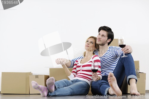 Image of Young couple moving in new home
