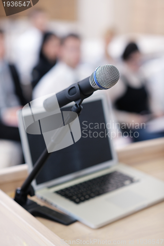 Image of laptop on conference speech podium