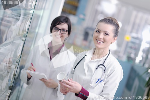 Image of team of pharmacist chemist woman  in pharmacy drugstore