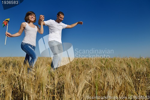 Image of happy couple in wheat field