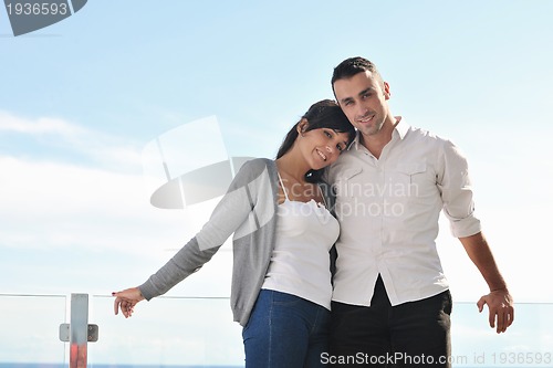 Image of couple relaxing on balcony