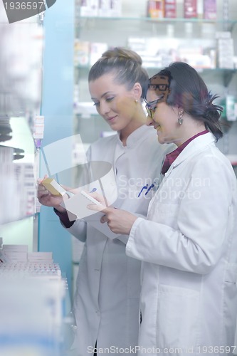 Image of team of pharmacist chemist woman  in pharmacy drugstore