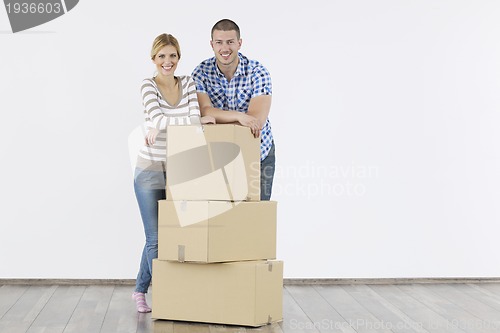 Image of Young couple moving in new home