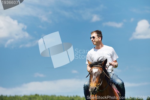 Image of man ride horse