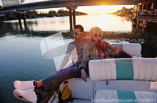 Image of couple in love  have romantic time on boat