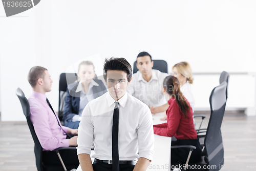 Image of young business man at meeting