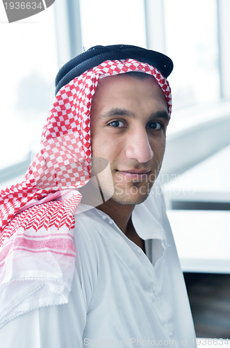 Image of arab business man at bright office