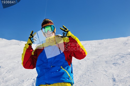 Image of skiing on fresh snow at winter season at beautiful sunny day