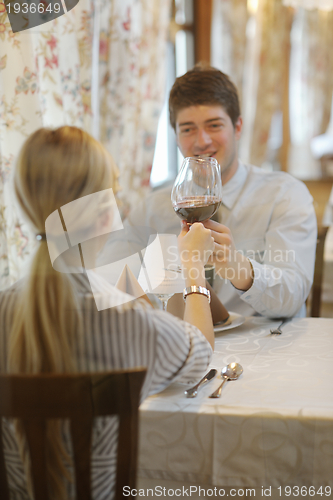 Image of young couple having dinner at a restaurant