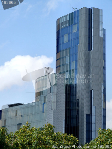 Image of Modern skyscraper and trees