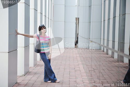 Image of beautiful young woman in the city