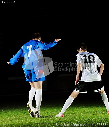 Image of football players in action for the ball