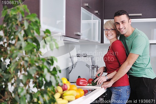 Image of young couple have fun in modern kitchen