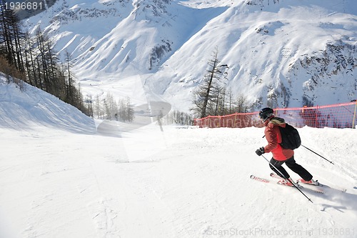 Image of skiing on fresh snow at winter season at beautiful sunny day