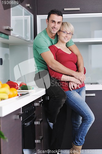 Image of young couple have fun in modern kitchen