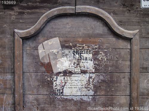 Image of Old poster on wooden wall