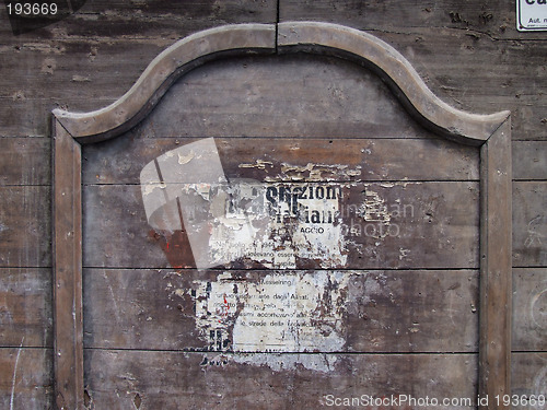 Image of Old poster on wooden wall