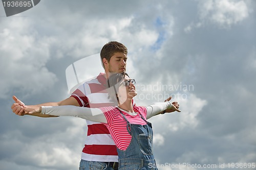 Image of romantic young couple in love together outdoor