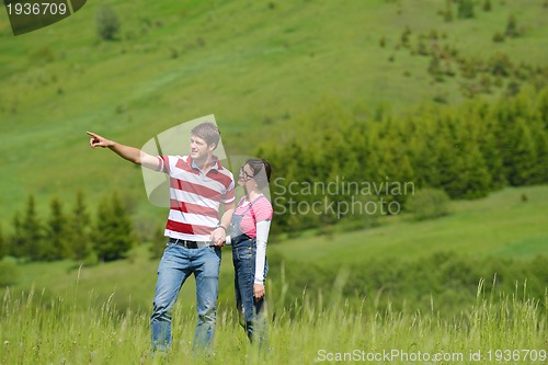 Image of romantic young couple in love together outdoor
