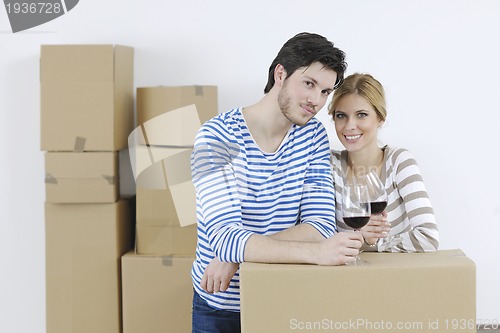 Image of Young couple moving in new home