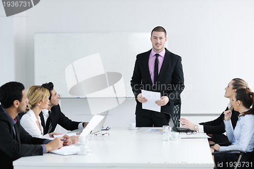 Image of Group of young business people at meeting