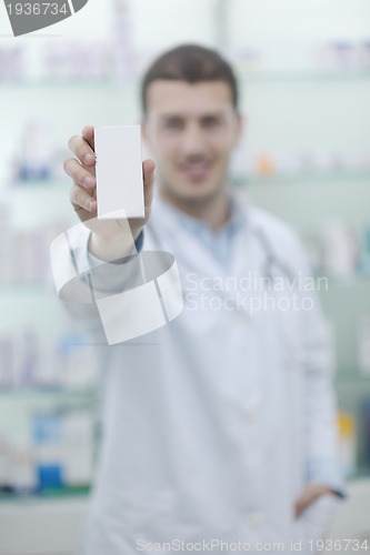 Image of pharmacist chemist man in pharmacy drugstore