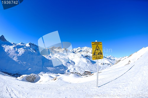 Image of Sign board at High mountains under snow in the winter