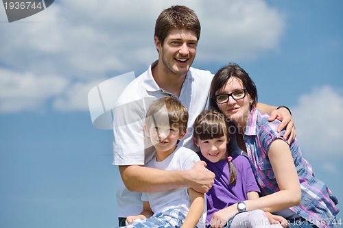Image of happy young family have fun outdoors