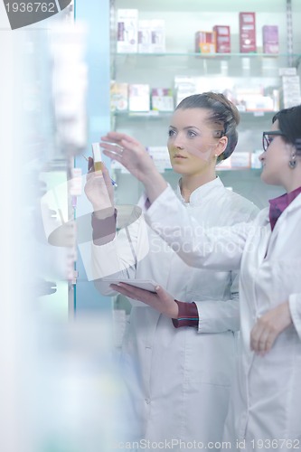 Image of team of pharmacist chemist woman  in pharmacy drugstore